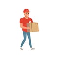 Cartoon delivery man carrying cardboard box. Smiling courier character in working uniform red t-shirt, cap and blue Royalty Free Stock Photo