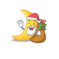 Cartoon design of crescent moon Santa with Christmas gift