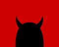 Cartoon devil character on a red background. Silhouette of a black horned head