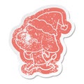 cartoon distressed sticker of a elephant remembering wearing santa hat