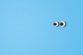 Cartoon eyes looking left side on blue background. Royalty Free Stock Photo