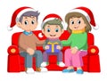 Cartoon family celebrating christmas and sitting on the sofa