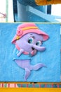 Cartoon fish wearing hat.