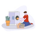 Cartoon flat illustration - the guy in the blue dress with folded clothes in his hands next to a washing machine and detergent Royalty Free Stock Photo