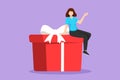 Cartoon flat style drawing businesswoman sitting on gift box. Big present concept. Female sitting on big box with present. Happy Royalty Free Stock Photo