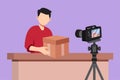 Cartoon flat style drawing young male vlogger unbox and review product live on streaming channel in studio. Social media