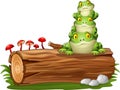 Cartoon frog stacked on tree log Royalty Free Stock Photo