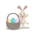 Cartoon funny easter bunny with big basket and painted colorful eggs. Spring character mascot and seasonal vector illustration. Royalty Free Stock Photo