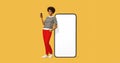 Smiling happy young afro american woman she standing near big blank screen mobile cell phone with workspace copy space mockup area Royalty Free Stock Photo