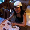 Cartoon girl sitting in a restaurant and very surprised looking through the menu