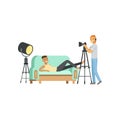 Cartoon guy model character posing lying on couch. Photographer with headphone and professional camera on tripod Royalty Free Stock Photo