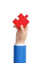 Cartoon hand holding a red puzzle piece. 3d illustration Royalty Free Stock Photo