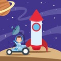 Cartoon happy astronaut boy in a space car and rocket