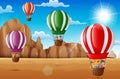 Cartoon happy kids riding hot air balloon in the desert Royalty Free Stock Photo