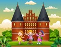 Cartoon of Happy school children standing in front of Holstentor building