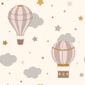 Cartoon hot air balloon nursery seamless background with clouds, stars on beige background Royalty Free Stock Photo