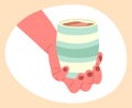 Cartoon hot coffee drink. Cappuccino cup in hand, hand holding cup of hot cocoa or coffee isolated flat vector illustration on Royalty Free Stock Photo