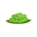 Flat vector icon of kuih ketayap on green leaf. Traditional Malaysian dessert. Sweet food. Asian cuisine