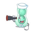 A cartoon icon of serratia marcescens Sailor with binocular Royalty Free Stock Photo