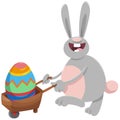 Cartoon Easter bunny with big egg on wheelbarrow Royalty Free Stock Photo