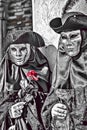 Cartoon illustration of silver couple wearing mask and costume with red rose during Venice Carnival in Italy