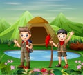 Two boys in camping uniform exploring a nature