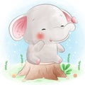 Cute elephant sitting on tree stump with butterfly Royalty Free Stock Photo