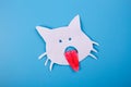 cartoon image of cat with tongue