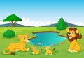 Cartoon lion family near watering hole