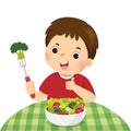 Cartoon of a little boy eating fresh vegetable salad and showing thumb up sign Royalty Free Stock Photo