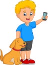 Cartoon little boy holding a mobile phone with his pet dog Royalty Free Stock Photo