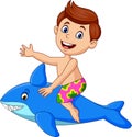 Cartoon little boy riding a inflatable shark Royalty Free Stock Photo