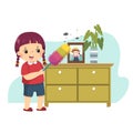 Cartoon of a little girl dusting the cabinet. Kids doing housework chores at home concept