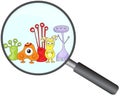 Cartoon microbes peek out from a magnifying lens Royalty Free Stock Photo
