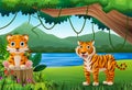 Cartoon mother tiger and child in the jungle