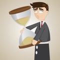 Cartoon puppet businessman holding sandglass Royalty Free Stock Photo