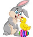 Cartoon rabbit with a baby chick standing on Easter egg