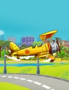 Cartoon scene with vintage vehicle biplane flying near park road - illustration for children
