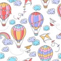 Cartoon seamless pattern with hot air balloons, kites, paper planes, clouds and rainbow on white background Royalty Free Stock Photo