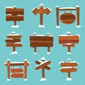 Cartoon snowed signpost. Christmas wooden signpost with snowcap. Arrows on snow and direction signs with icicles on top vector set Royalty Free Stock Photo