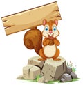 Squirrel holding a wooden sign on a rock Royalty Free Stock Photo