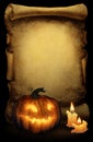 Halloween background with carved pumpkin lamp and candles