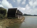 Cartoon style picture of wooden houses in traditional Palauan style on the ocena coast in Koror, Palau. Royalty Free Stock Photo