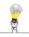 Cartoon Tired Businessman Carrying a Heavy Big Gray light Bulb Royalty Free Stock Photo