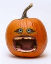 Comic screaming halloween jack-o`-lantern pumpkin isolated on white