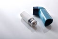 Cartridge and blue medicine inhaler elevated view