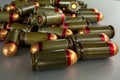 Cartridges bulk close up images. Bullets in shells for gun are piled randomly. Weapon armory concept