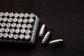 Cartridges for a pistol on a black. Flat lay copyspace