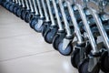 Carts lined up together. Many wheels from shopping carts Royalty Free Stock Photo