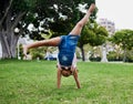 Cartwheel, child and outdoor park fun of a girl in summer with freedom and happiness. Fun, happy and holiday play of a Royalty Free Stock Photo